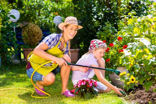 About Us Gardeners Custom House in a well-kept garden setting
