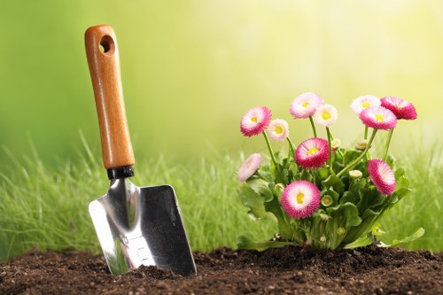 Trained garden staff using protective equipment during maintenance